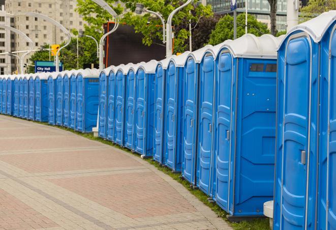 hygienic portable restrooms lined up at a music festival, providing comfort and convenience for attendees in Davie FL